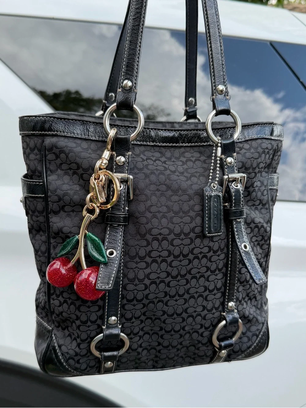 Coach Black Signature Canvas Shoulder Tote with Red Cherry Charm